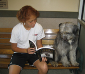 Child reading to dog at the Washington Animal Rescue League